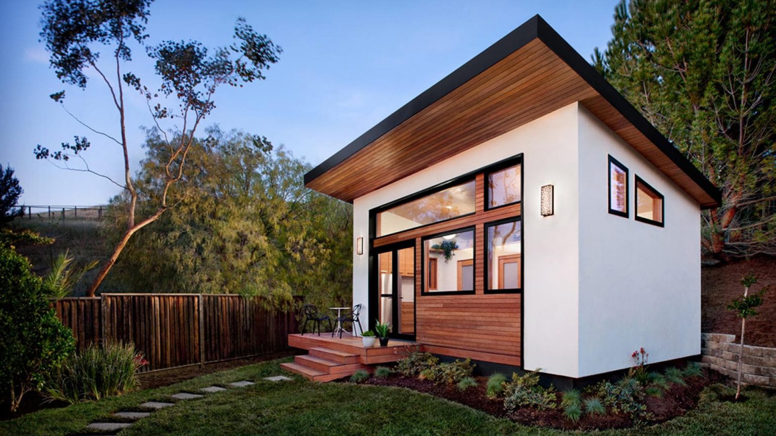 Image of a small, white newly constructed house
